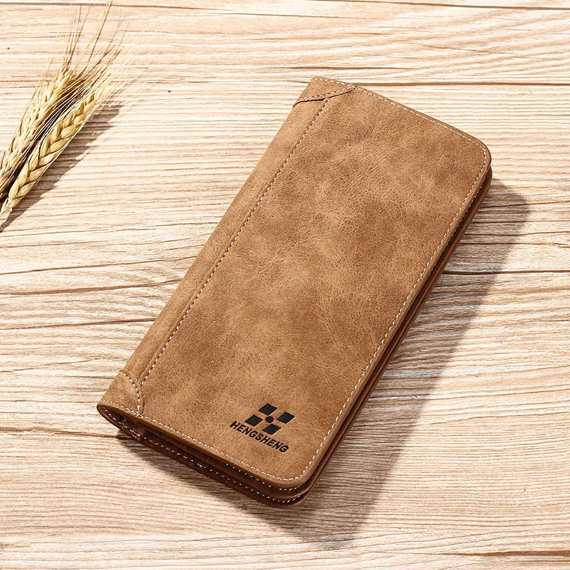 Long men's bi-fold PU leather wallet in brown with car suture stitching, open showing card slots and bill holder