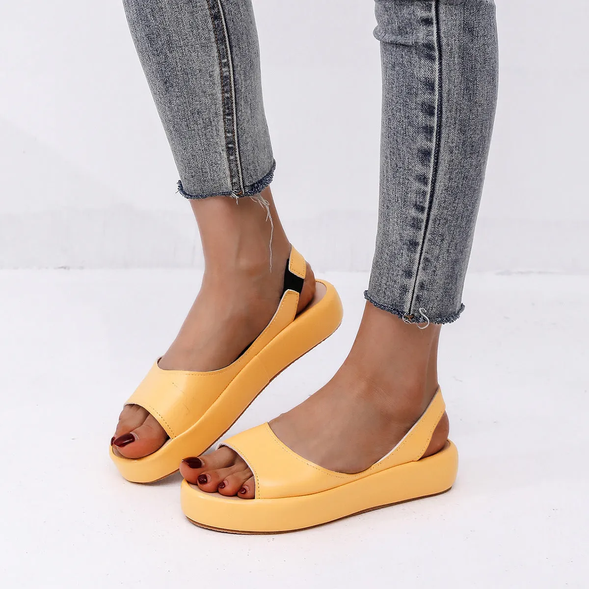 Women's summer fish mouth flat sandals in solid colour with back strap design, side hollow detail, artificial PU upper, rubber sole