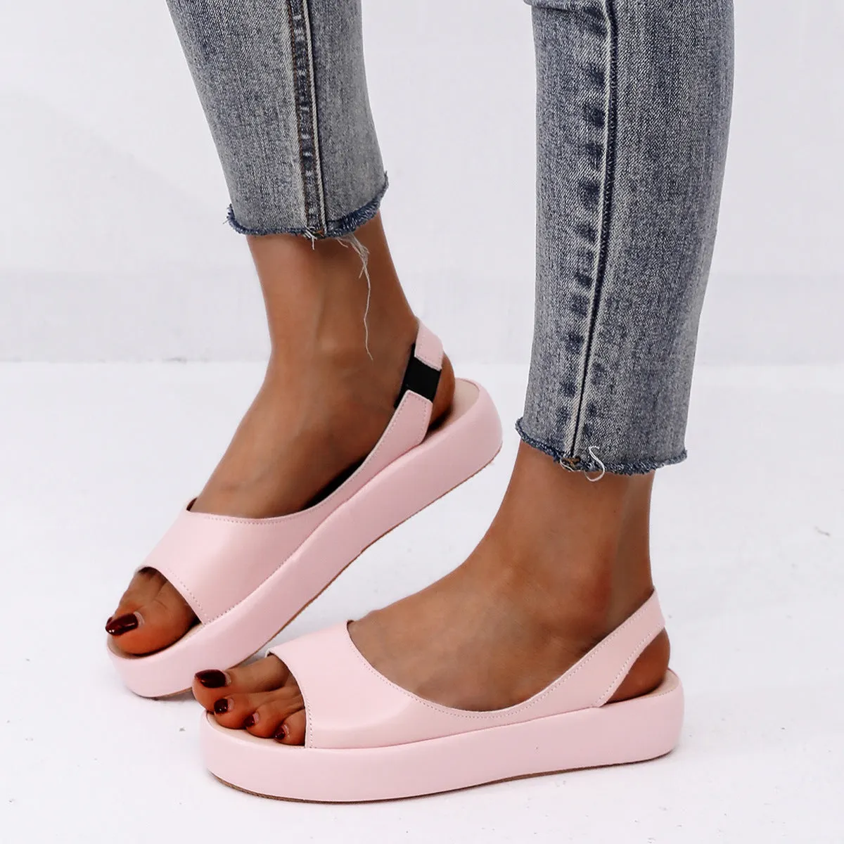 Women's summer fish mouth flat sandals in solid colour with back strap design, side hollow detail, artificial PU upper, rubber sole