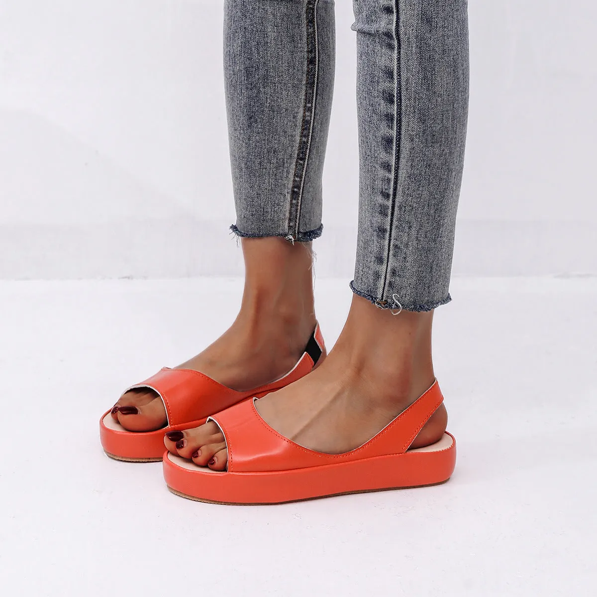 Women's summer fish mouth flat sandals in solid colour with back strap design, side hollow detail, artificial PU upper, rubber sole