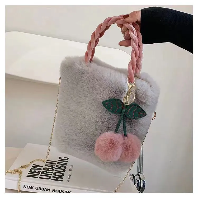 Large soft plush travel bucket bag in beige with open pocket and single shoulder strap