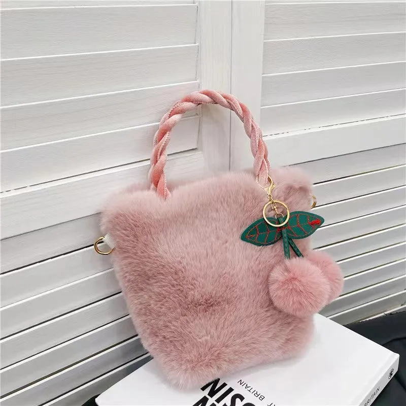 Large soft plush travel bucket bag in beige with open pocket and single shoulder strap