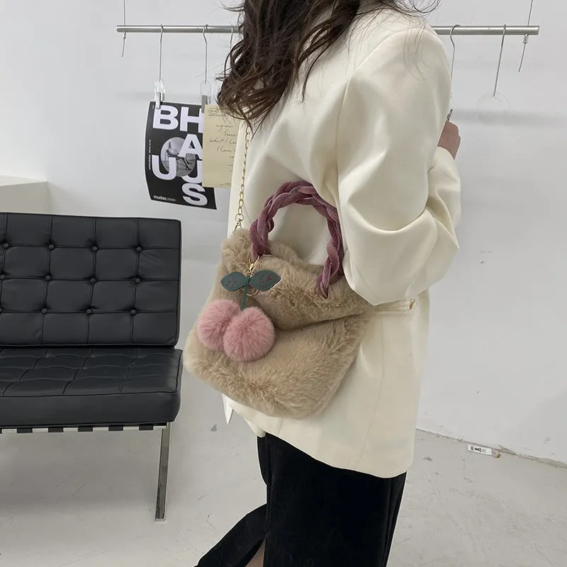 Large soft plush travel bucket bag in beige with open pocket and single shoulder strap