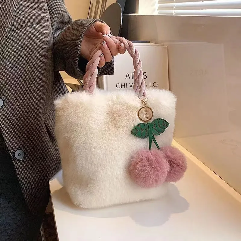 Large soft plush travel bucket bag in beige with open pocket and single shoulder strap