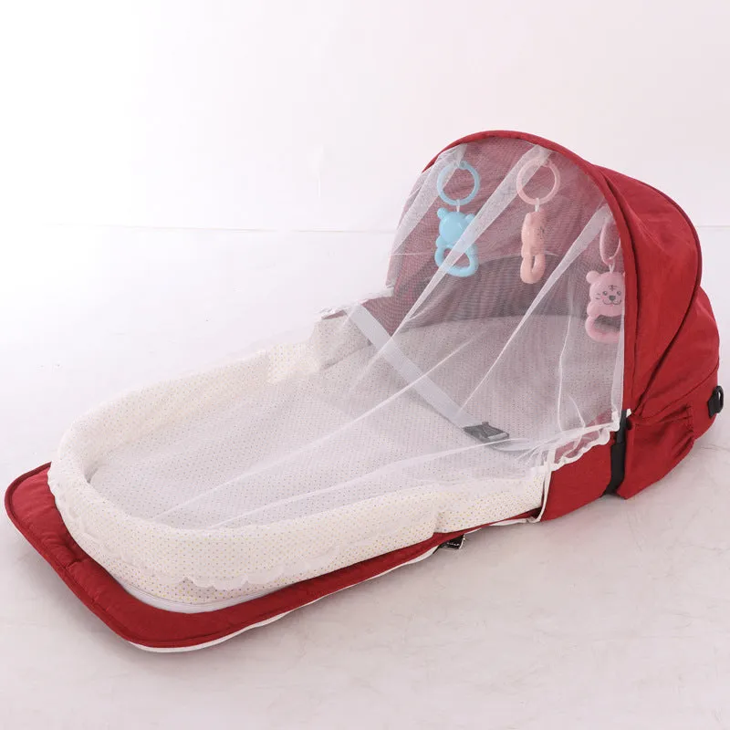 Portable foldable baby anti-mosquito isolation bed with grey cotton linen fabric, open on a grassy area