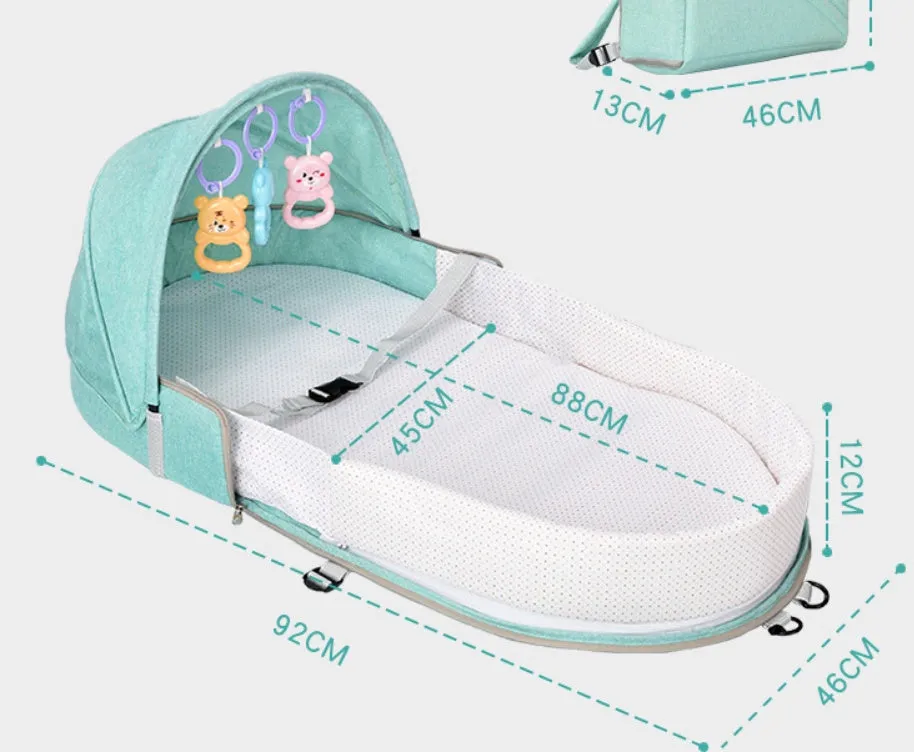 Portable foldable baby anti-mosquito isolation bed with grey cotton linen fabric, open on a grassy area