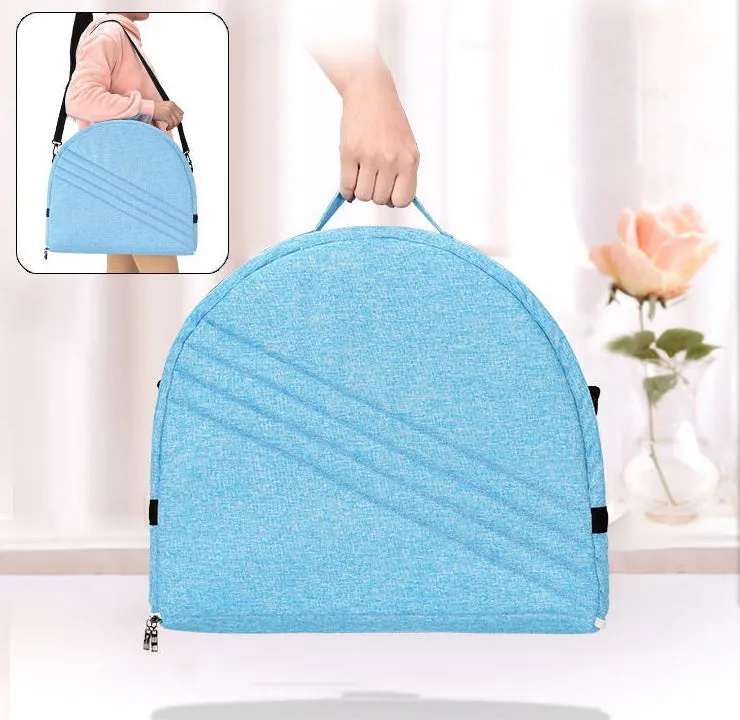 Portable foldable baby anti-mosquito isolation bed with grey cotton linen fabric, open on a grassy area