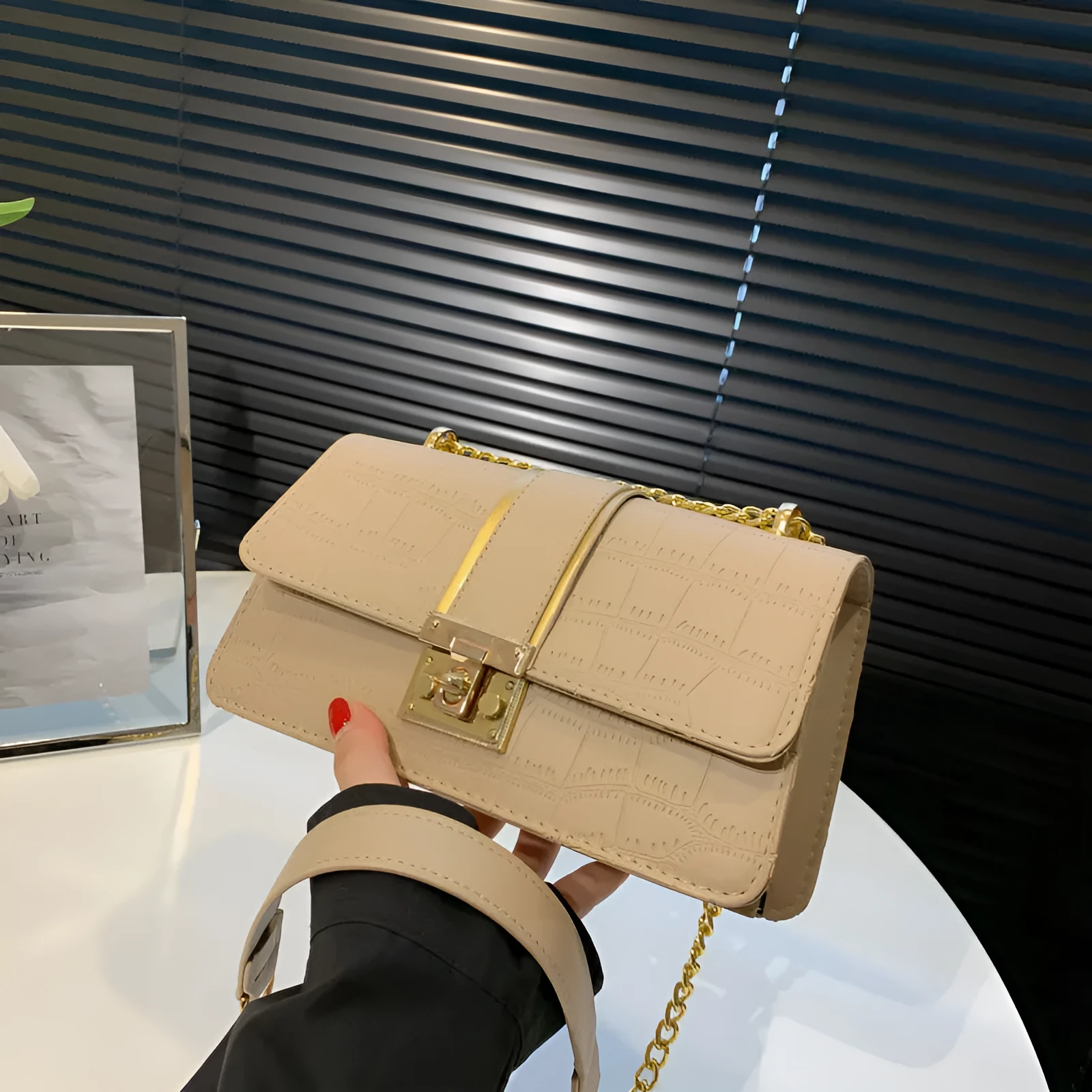 Horizontal square PU shoulder bag in khaki with contrast stitching and chain strap on a white background