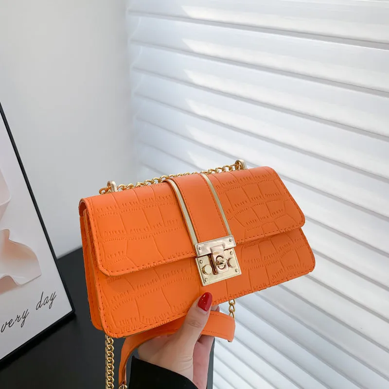 Horizontal square PU shoulder bag in khaki with contrast stitching and chain strap on a white background
