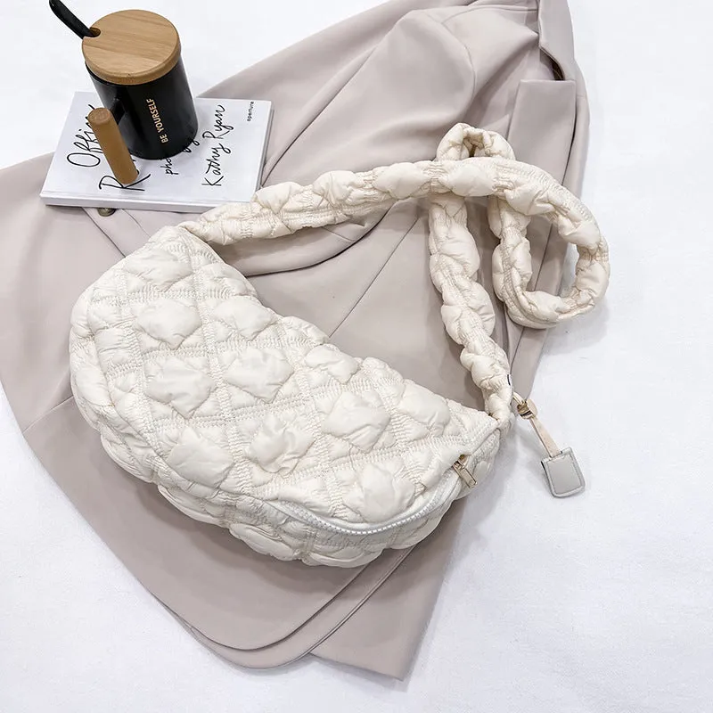 Women's nylon messenger bag in solid colour with adjustable shoulder strap, shown in beige