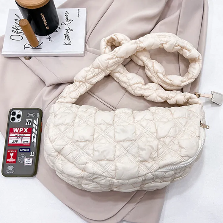 Women's nylon messenger bag in solid colour with adjustable shoulder strap, shown in beige