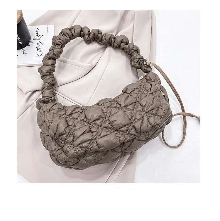 Women's nylon messenger bag in solid colour with adjustable shoulder strap, shown in beige