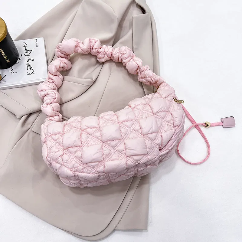 Women's nylon messenger bag in solid colour with adjustable shoulder strap, shown in beige