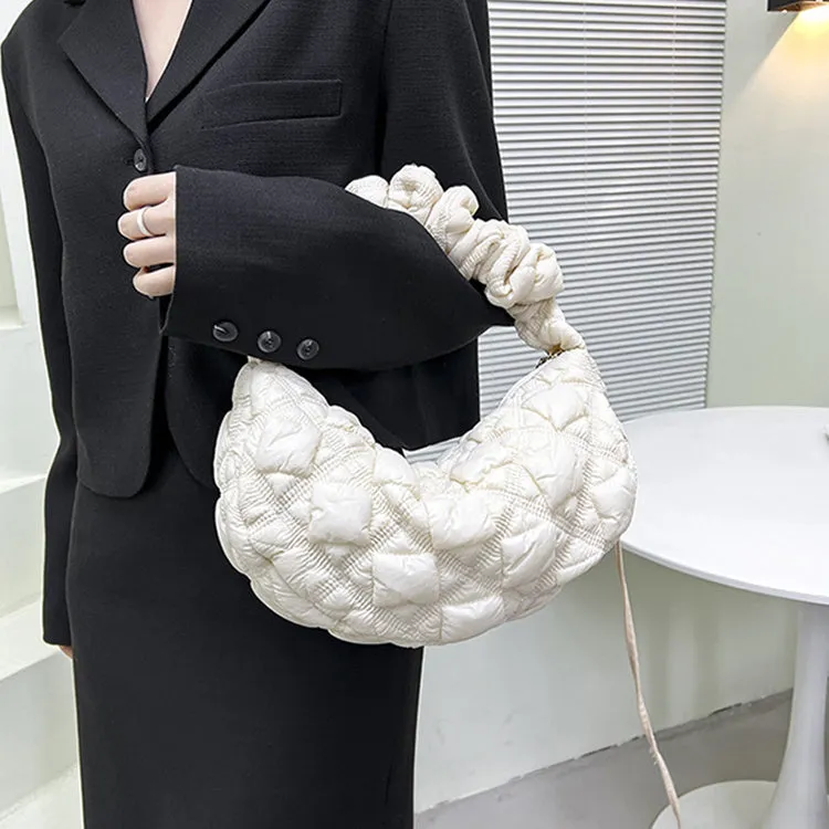 Women's nylon messenger bag in solid colour with adjustable shoulder strap, shown in beige