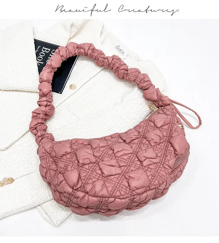Women's nylon messenger bag in solid colour with adjustable shoulder strap, shown in beige