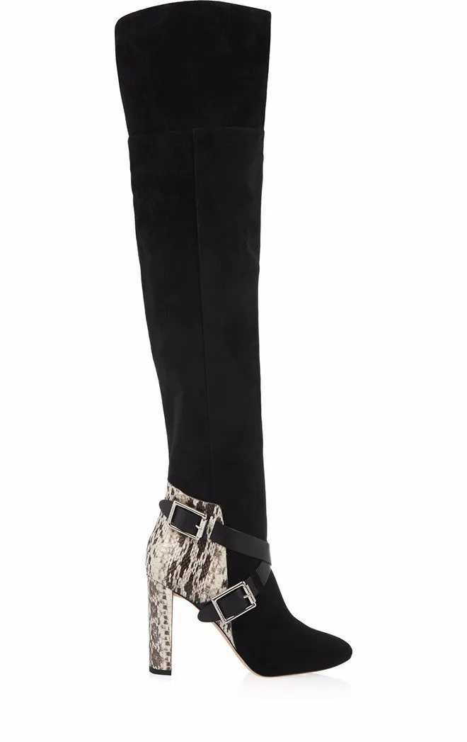 Women's black suede fashion boots with thick super high heel and round toe on a clean background