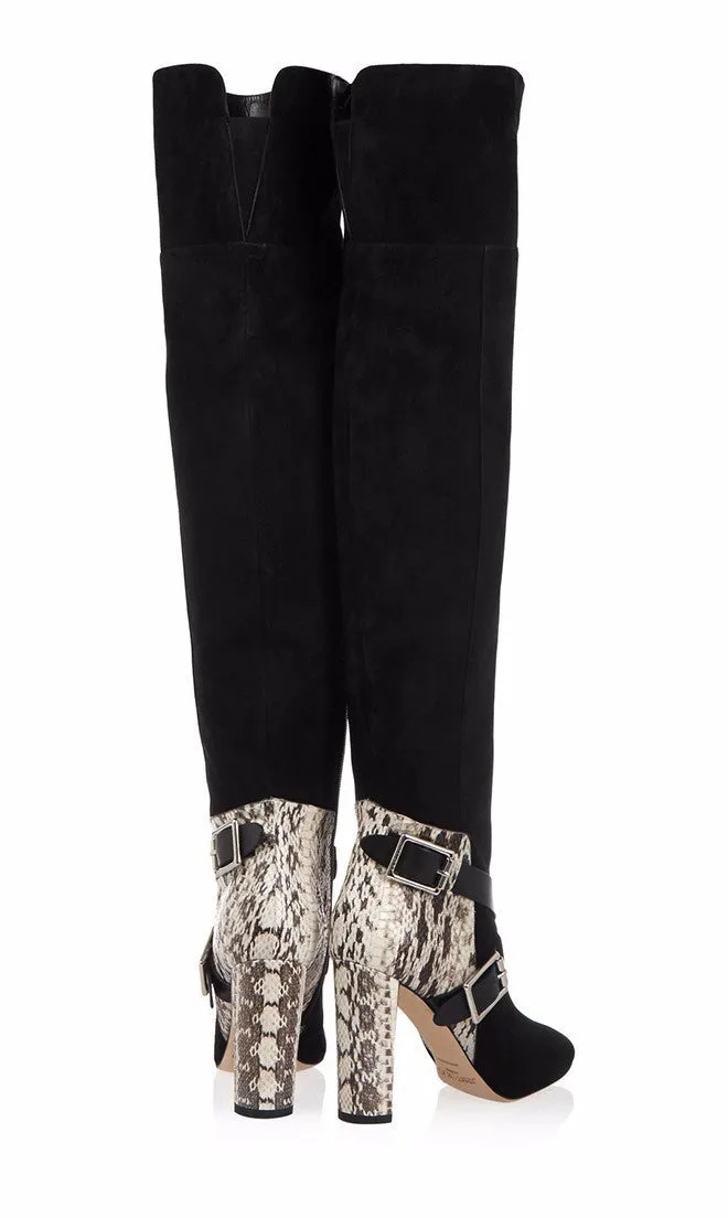 Women's black suede fashion boots with thick super high heel and round toe on a clean background
