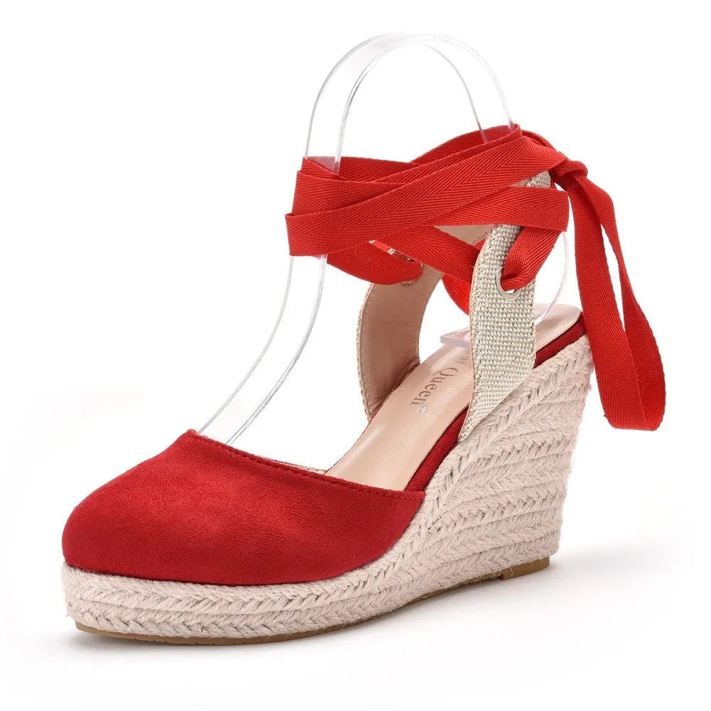 Women's bohemian wedge sandals with beaded details and a buckle strap.