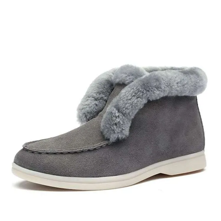 Women's round toe suede Martin boots in beige with rubber sole on a neutral background
