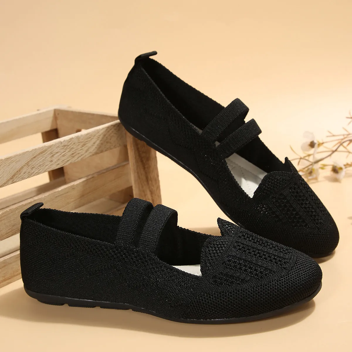 Women's casual mesh slip-on flats in black with round toe, flat heel, and breathable upper