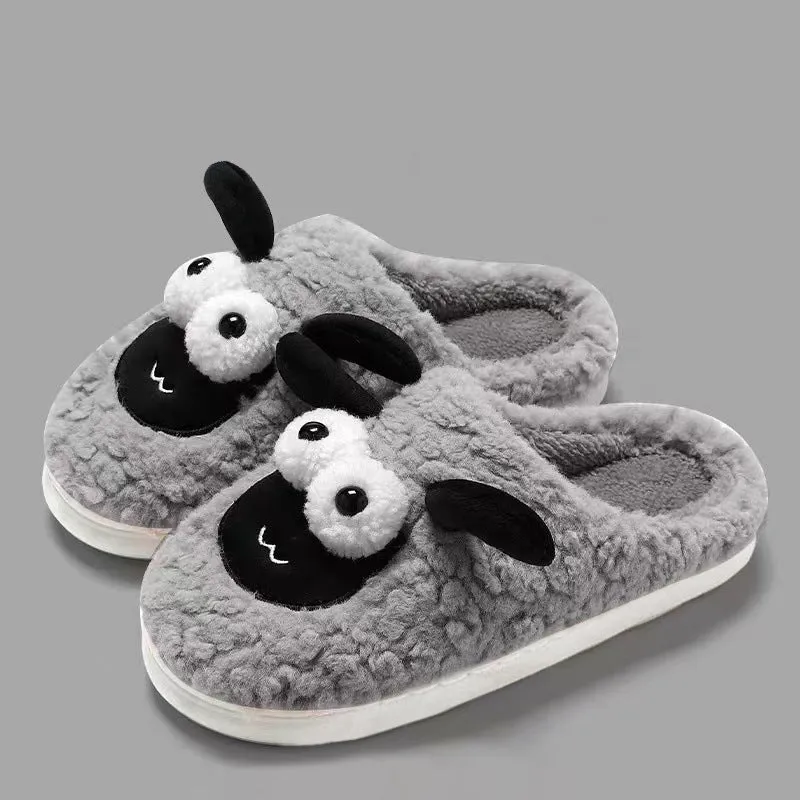 Brown lamb thermal cotton slip-on slippers with suede upper on a wooden floor.