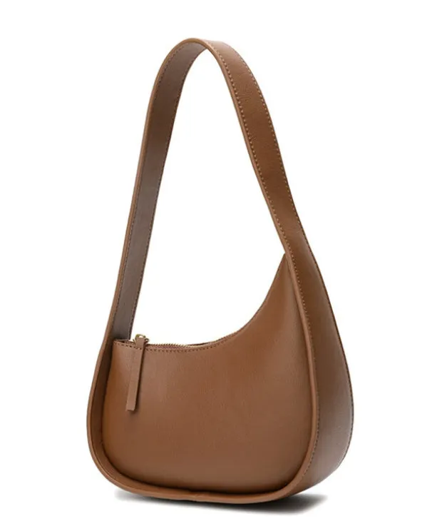 Half moon shaped leather ladies handbag with wide shoulder strap in small size