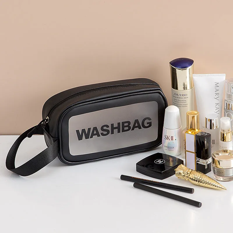 Korean transparent PU waterproof cosmetic bag in cherry pink, medium size, on a white background, showing its cube shape and zip closure.
