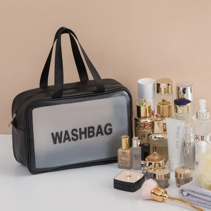 Korean transparent PU waterproof cosmetic bag in cherry pink, medium size, on a white background, showing its cube shape and zip closure.