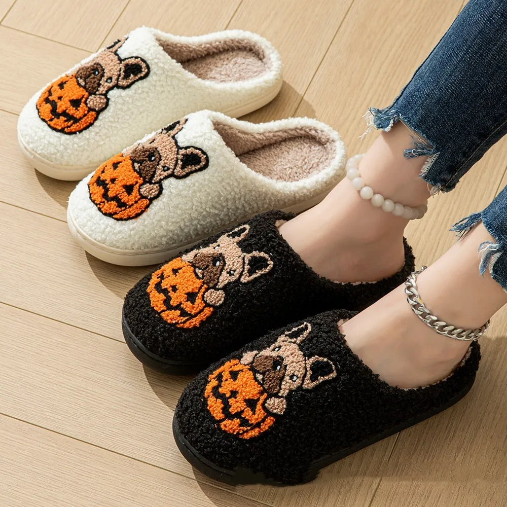 Black and white Halloween slippers with pumpkin pattern, plush upper, and textured rubber sole.