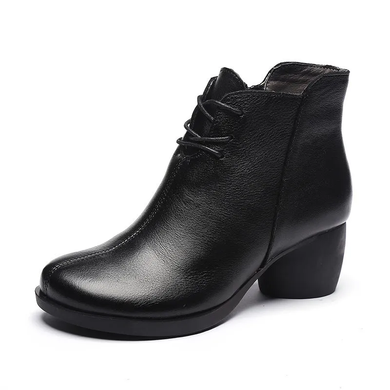 Women's brown leather Martin boots with a thick round heel and round toe.