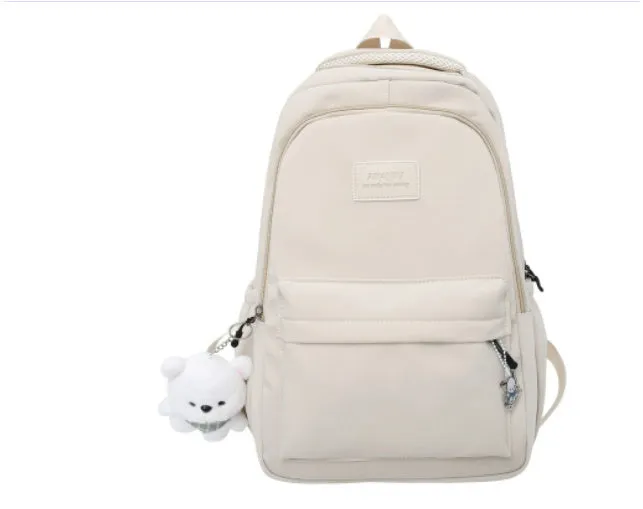Large capacity nylon backpack for women, waterproof and wear-resistant, in solid colour with zips and straps
