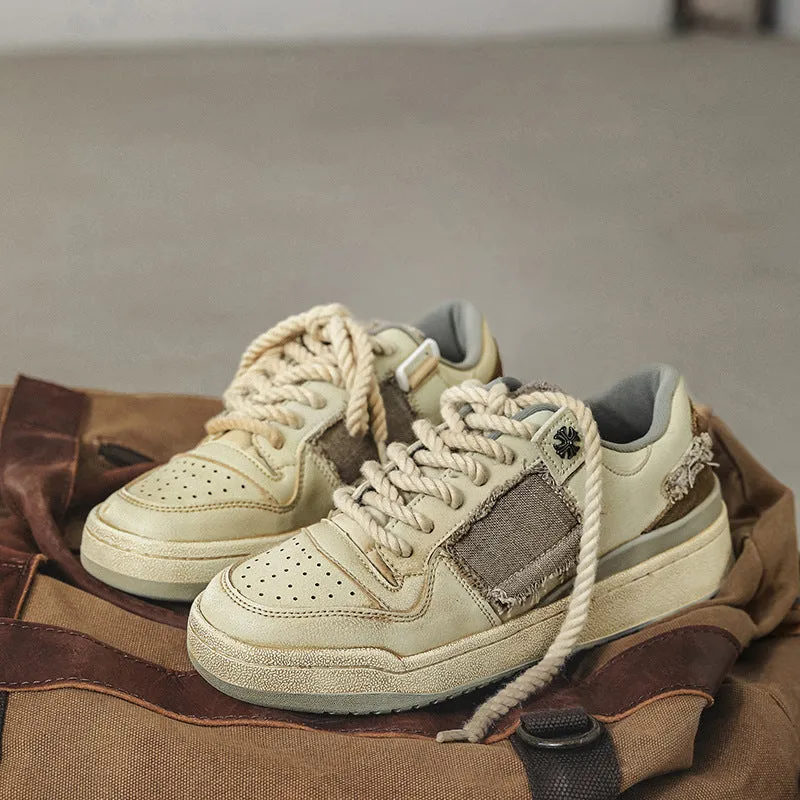 Beige low-top skateboard shoes with vintage patch design and rubber sole