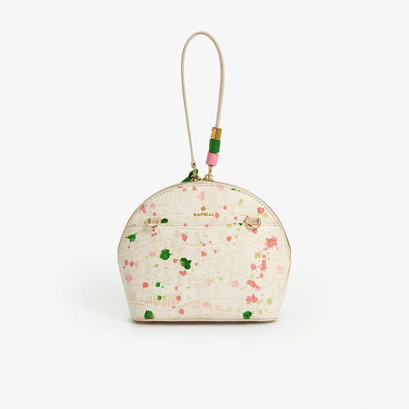 Women's shell-shaped tassel handbag in Gypsophila colour made from genuine cow leather with zipper closure