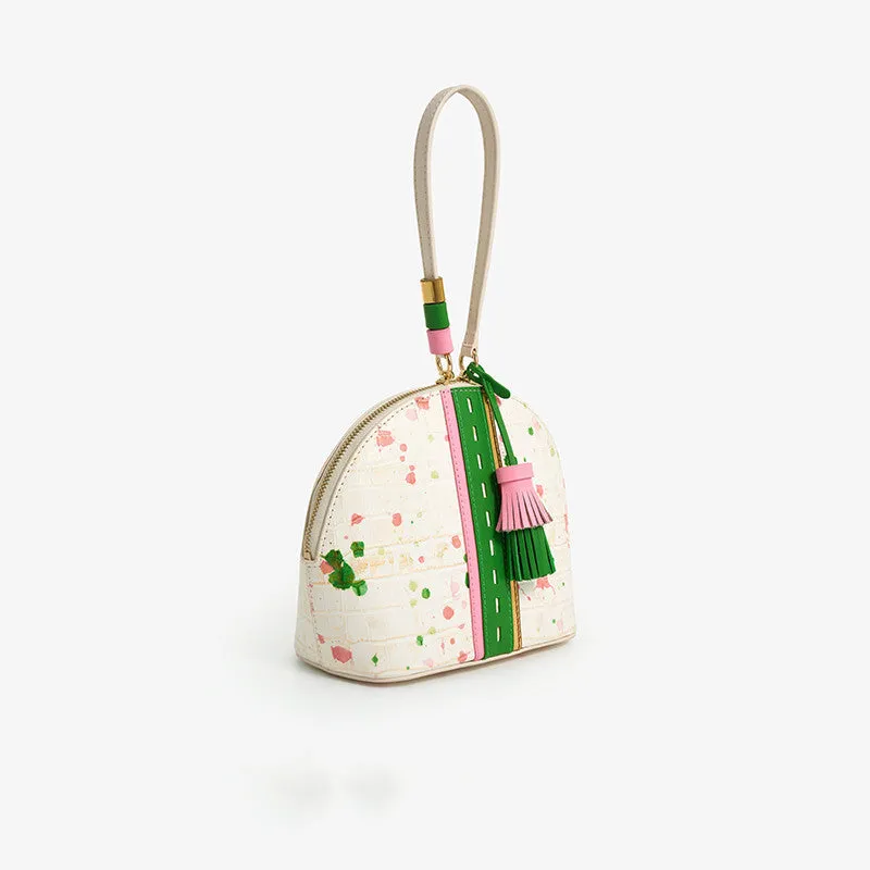 Women's shell-shaped tassel handbag in Gypsophila colour made from genuine cow leather with zipper closure