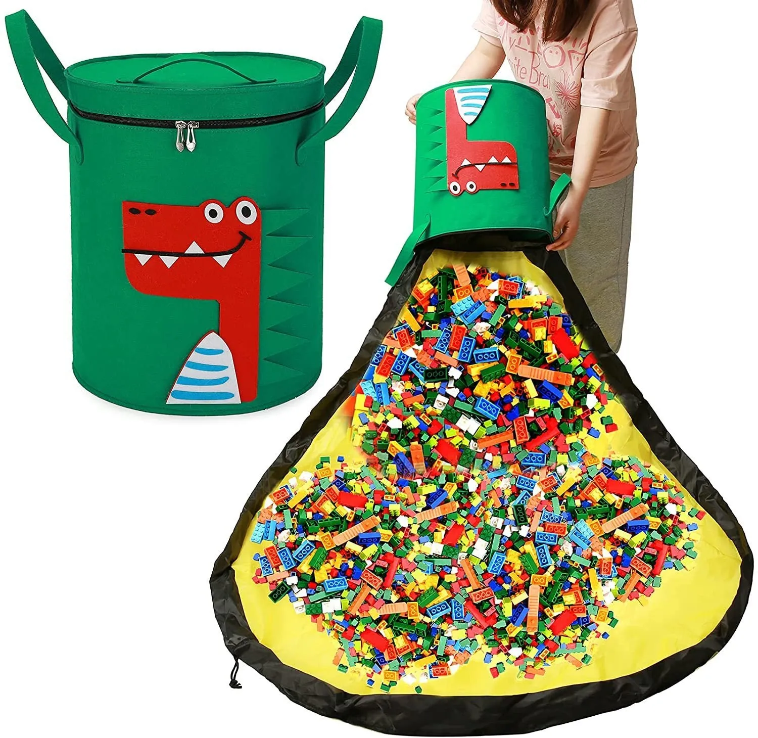 Green felt cube storage bag with pull rope, laid flat as a play mat next to toys.