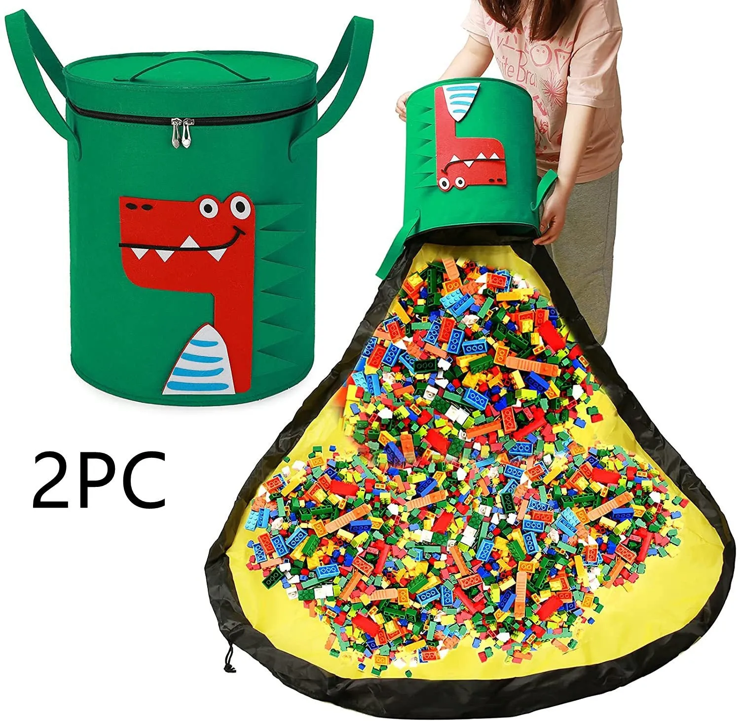 Green felt cube storage bag with pull rope, laid flat as a play mat next to toys.