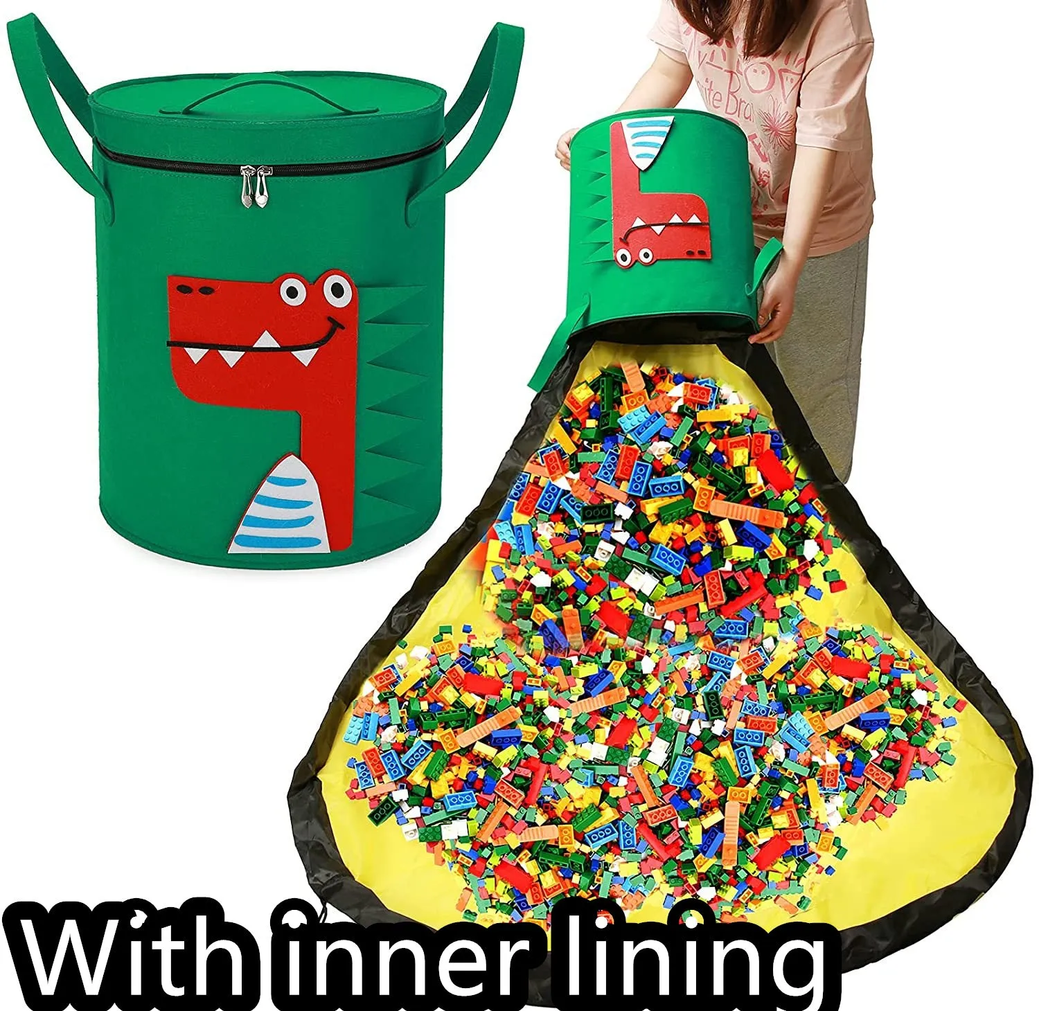 Green felt cube storage bag with pull rope, laid flat as a play mat next to toys.