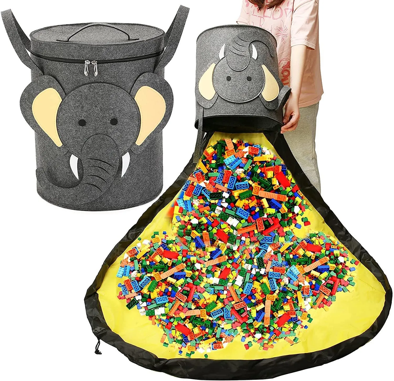 Green felt cube storage bag with pull rope, laid flat as a play mat next to toys.
