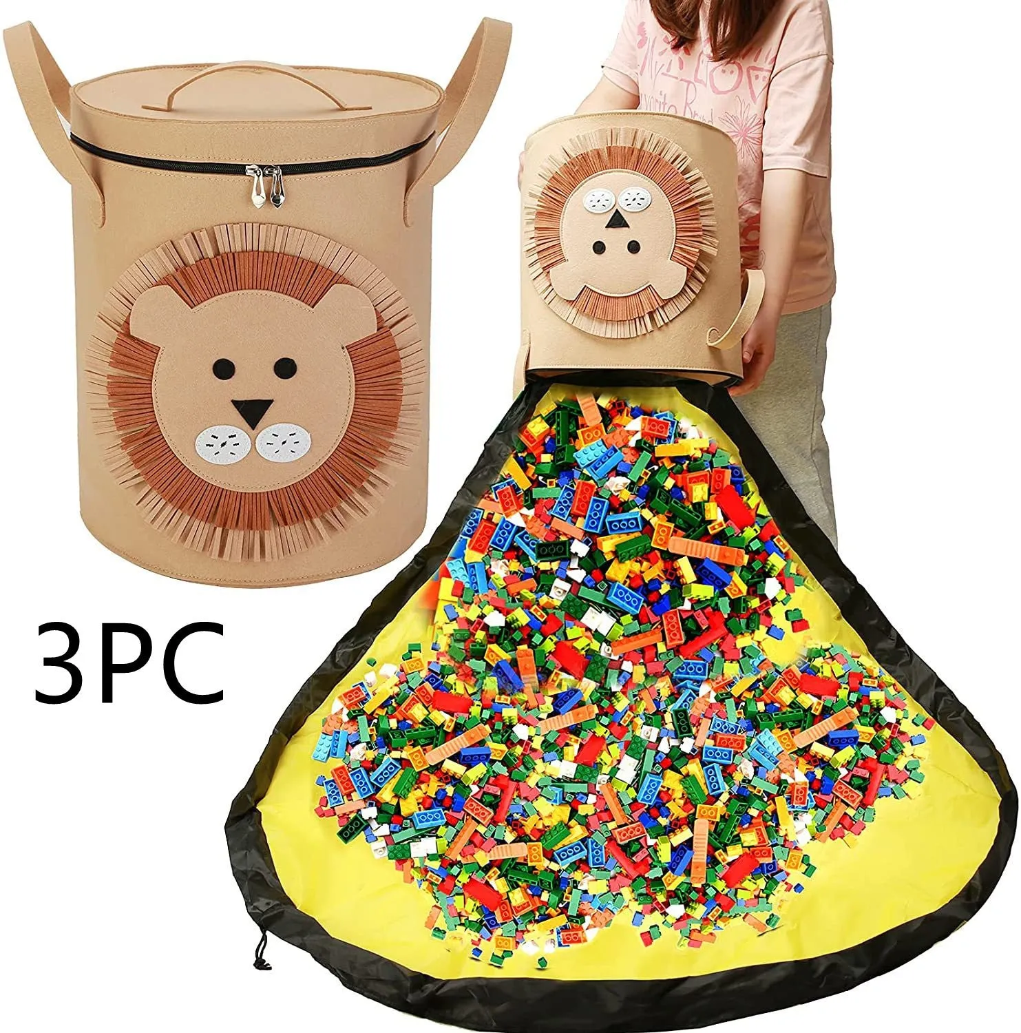 Green felt cube storage bag with pull rope, laid flat as a play mat next to toys.