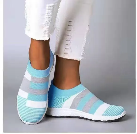 Women's knitted slip-on sneakers in grey with breathable mesh upper and flat foam sole