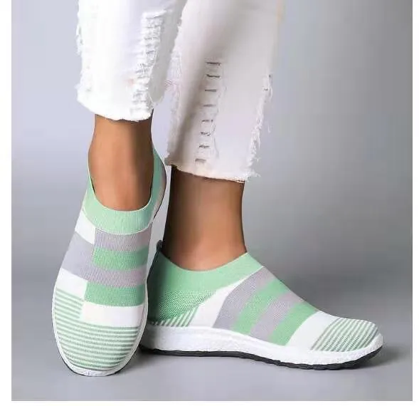 Women's knitted slip-on sneakers in grey with breathable mesh upper and flat foam sole