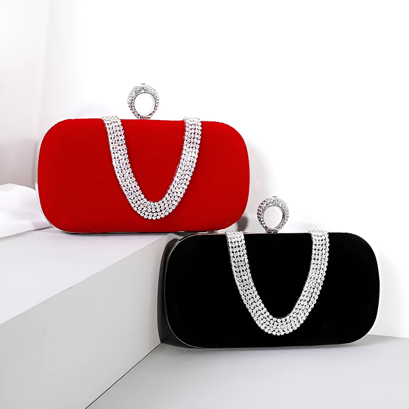 Small velvet evening clutch bag with rhinestones and lock closure, horizontal square shape, available in multiple colours.