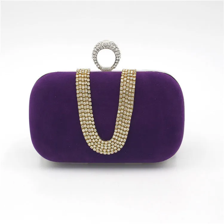 Small velvet evening clutch bag with rhinestones and lock closure, horizontal square shape, available in multiple colours.