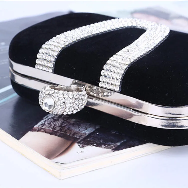 Small velvet evening clutch bag with rhinestones and lock closure, horizontal square shape, available in multiple colours.