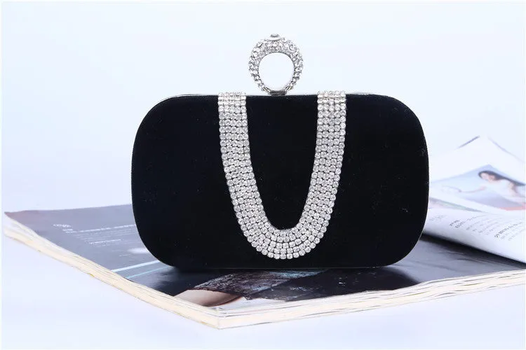 Small velvet evening clutch bag with rhinestones and lock closure, horizontal square shape, available in multiple colours.