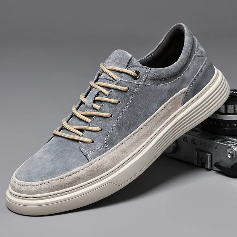 Men's grey pigskin leather casual skate shoes with round toe and flat rubber sole on a light background.