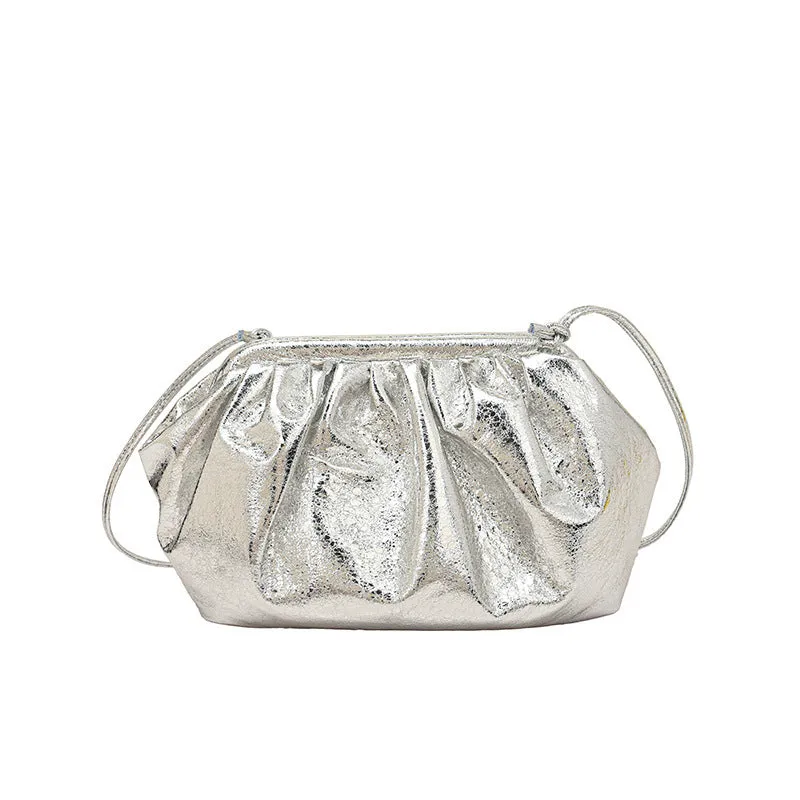 Shell-shaped crossbody bag with hair clip attachment in multiple colour options showing organised internal compartments
