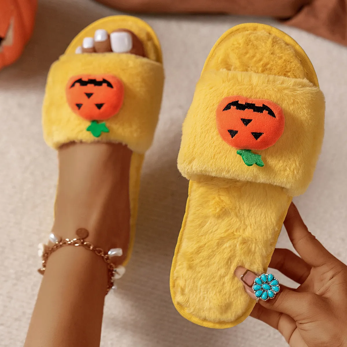 Yellow Halloween pumpkin plush open-toe slippers with synthetic fur and anti-slip PVC soles