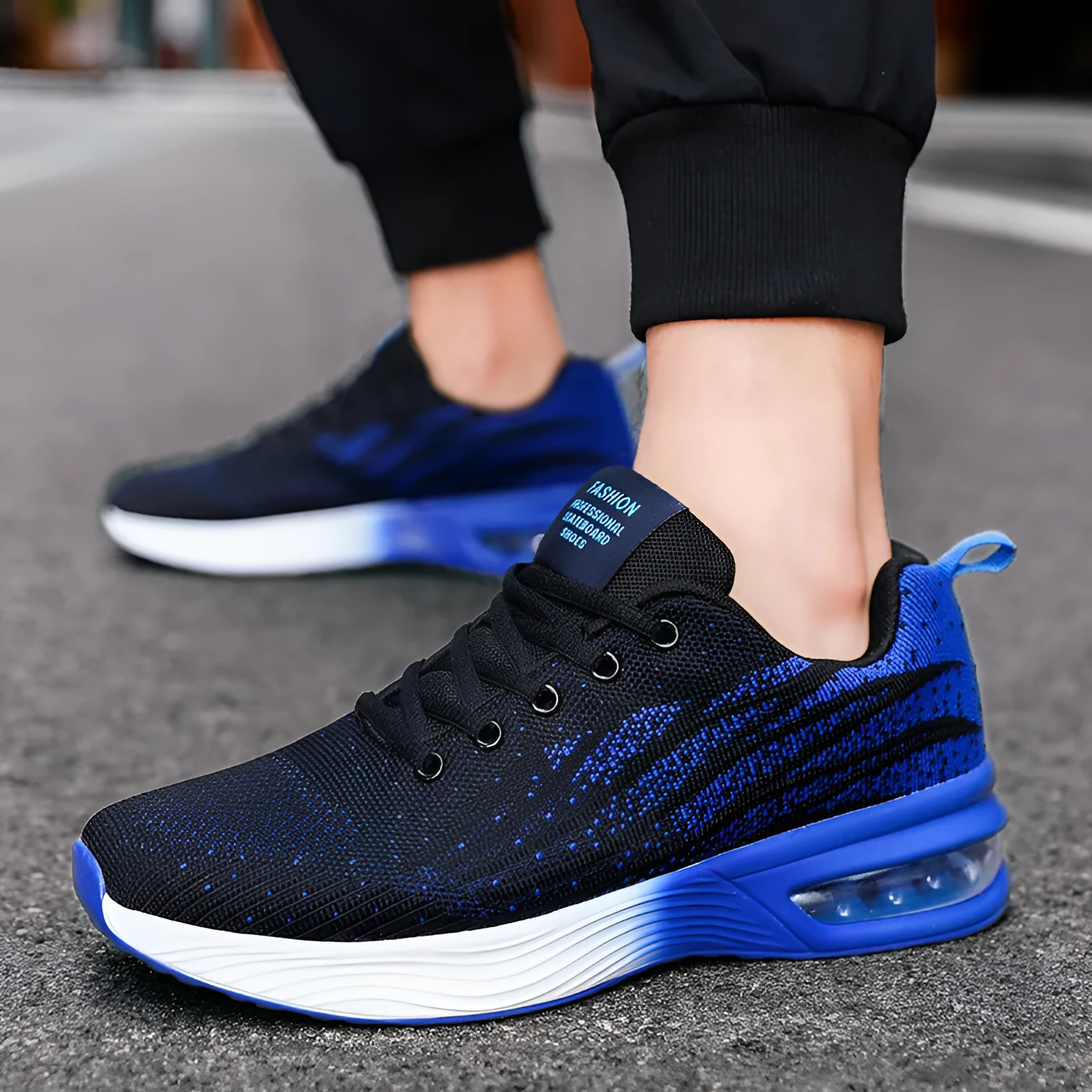 Men's air cushion casual running shoes in black and red with flyknit upper and wedge heel on white background