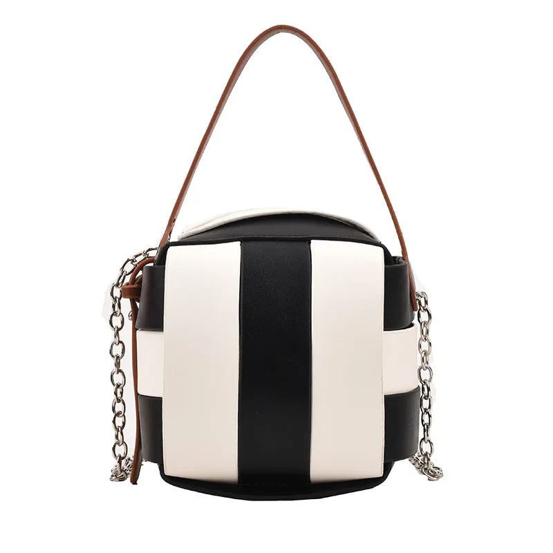 Women's PU leather vintage spliced crossbody handbag in black with magnetic buckle closure, 14cm size
